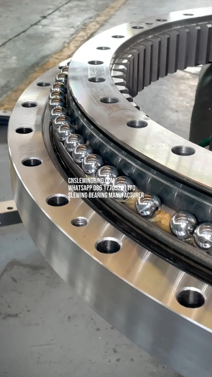 This is a slewing bearing with double rows of raceways. We are installing steel balls and isolation blocks…