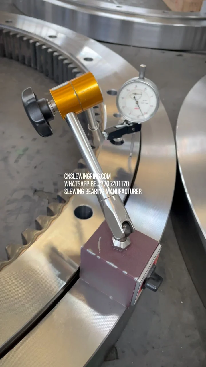 This is an internal tooth type slewing bearing, and we are measuring its end face runout by manual…